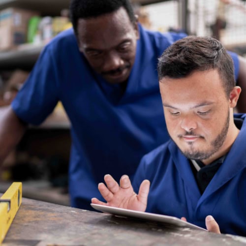 Two People At Work Table Getting Job Training