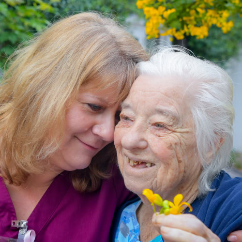 Woman Providing Care To Older Person