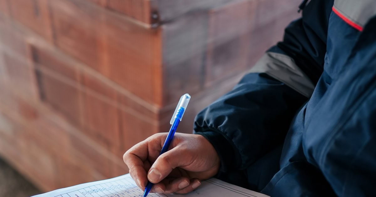 Man filling out paperwork 2