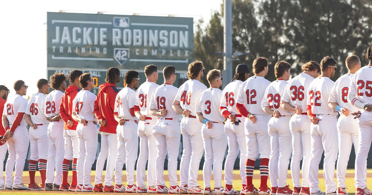 Baseball players at the jackie robinson celebration game for the national anthem